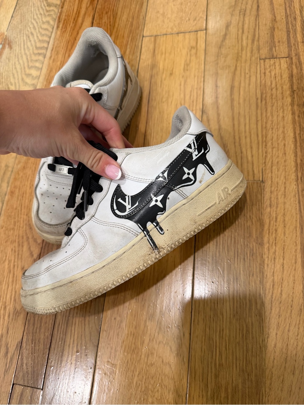 Nike White Sneakers with Black Graphic Swoosh